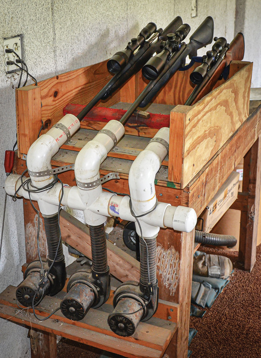 When developing a load capable of consistently shooting three bullets into less than a half-inch group for a customer’s rifle, Kenny Jarrett allows the barrel to cool to ambient temperature between each group fired. To speed up the process, he fashioned this 3-rifle barrel cooler from PVC pipe and automobile heater blowers from a local junk yard.